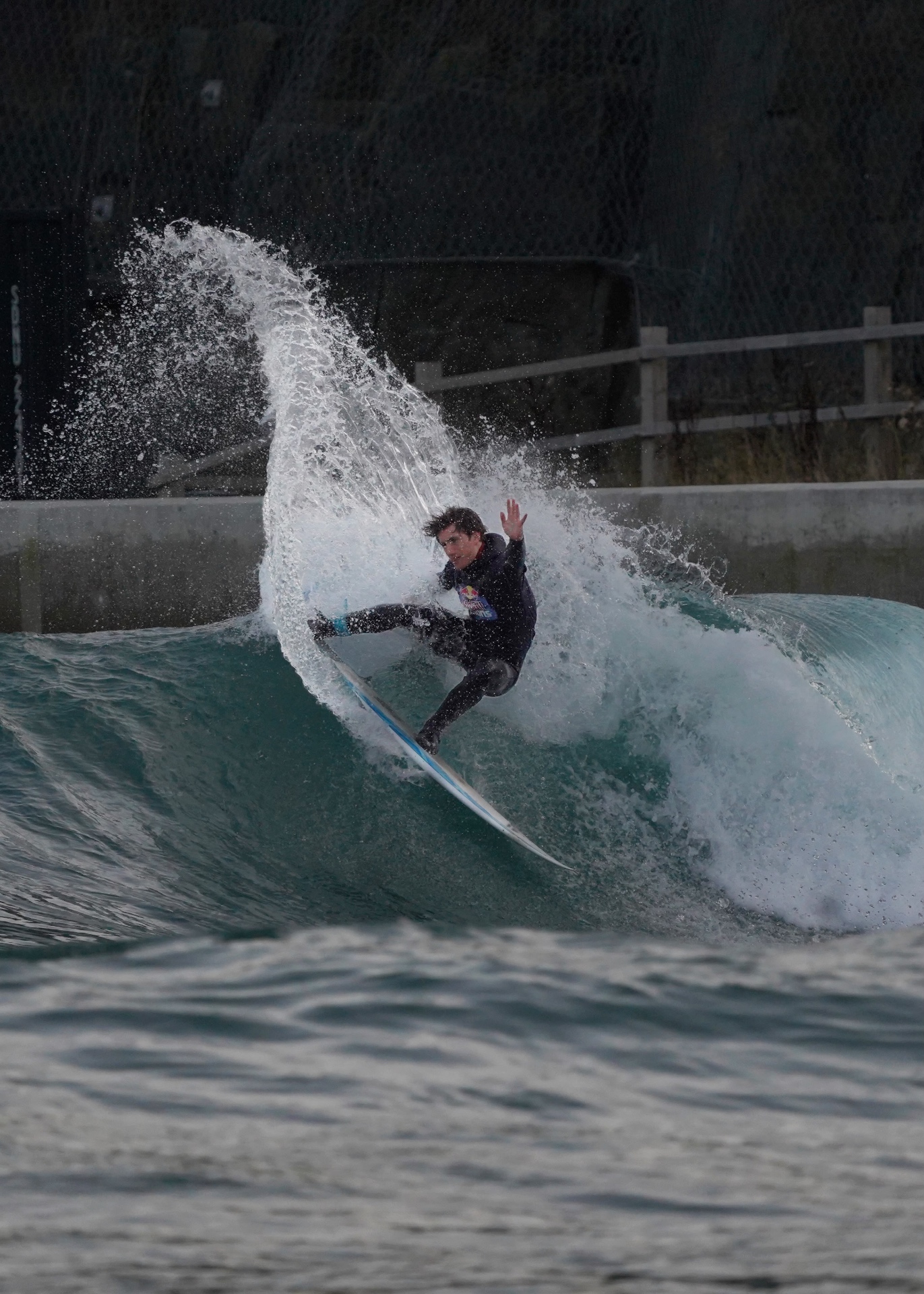 Surfer driving off the top of a clean wave