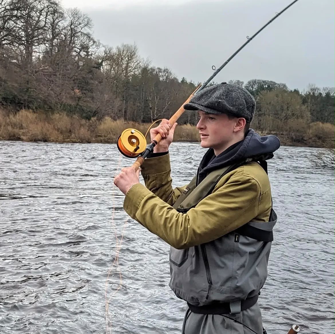 Harry Brownlow casting a fly rod in waders on a Northumberland river